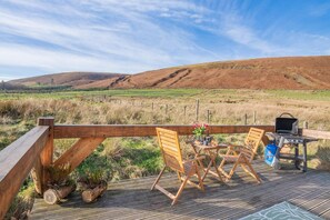 A wooden deck with a view of rolling hills, a grill, and outdoor seating. - 1 Bed in Newton In Bowland (oc-h34064) (Newton)