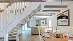A modern interior with a staircase, dining area, and a living space. - 3 Bed in Nr St. Keverne (oc-tremen) (Saint Keverne)