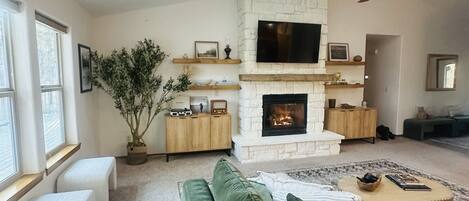 Smart TV, fireplace, books
