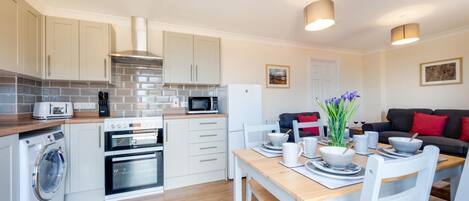 Microwave, oven, high chair, cookware/dishes/utensils