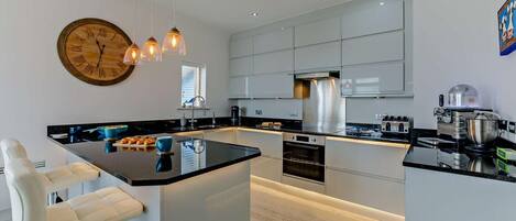 Dishwasher, high chair, cookware/dishes/utensils