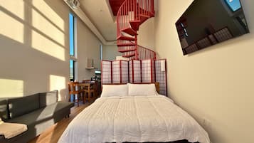 Tabla de planchar con plancha, wifi gratis y ropa de cama