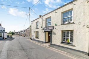 A building with a sign reading "RING O' BELLS" on the ground floor. - 2 Bed in St. Issey (oc-o27778) (Saint Issey)