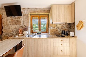 Fridge, microwave, stovetop, coffee/tea maker