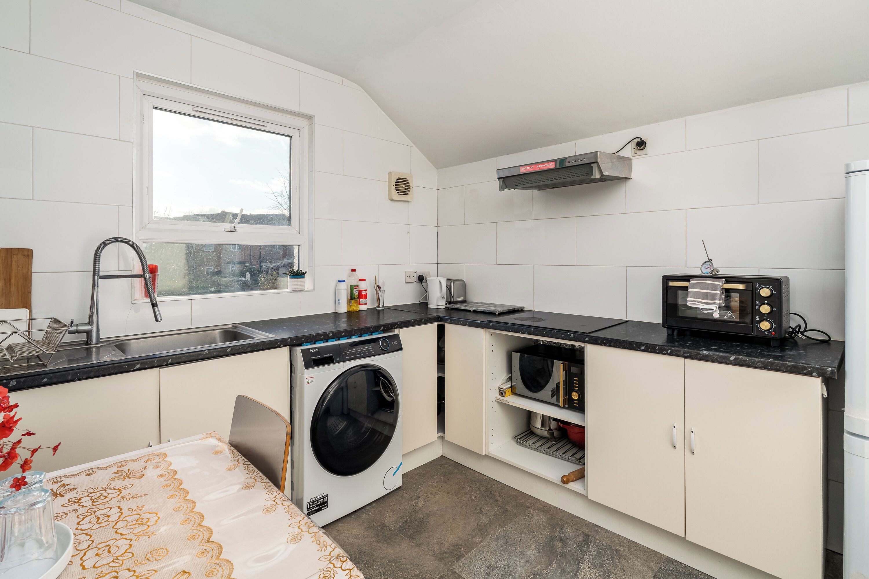 Fridge, microwave, oven, dining tables