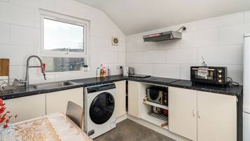 Fridge, microwave, oven, dining tables