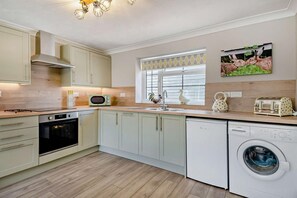 Microwave, dishwasher, cookware/dishes/utensils