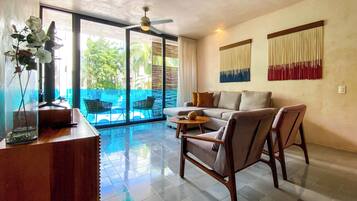 Deluxe Apartment | Living area | 50-inch Smart TV with digital channels