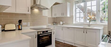 Oven, dishwasher, high chair, cookware/dishes/utensils