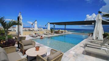 Outdoor pool, pool umbrellas, sun loungers