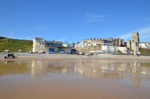 A coastal town with a mix of residential and commercial buildings, including a prominent tower. - 4 Bed in Cromer (oc-k28392) (Cromer)