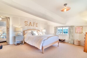 A bedroom with a bed, bedside tables, a window, and a 'SAFE' sign on the wall. - 3 Bed in Monk Soham (oc-h28366) (Monk Soham)