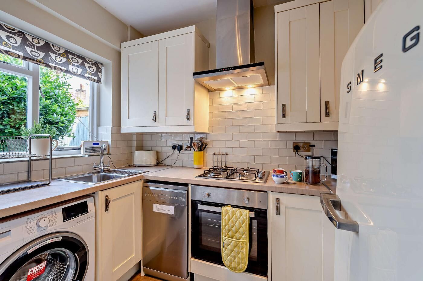 Oven, dishwasher, high chair, cookware/dishes/utensils