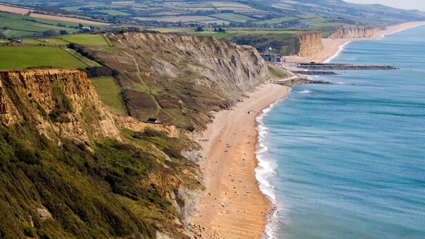 A coastal landscape with cliffs, a sandy beach, and a view of the sea. - 3 Bed in Axmouth (oc-t28930) (Axmouth)