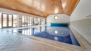 An indoor swimming pool with a wooden ceiling, a blue tiled floor, and a bench along the wall. - 3 Bed in Thwing (oc-t29011) (Thwing)