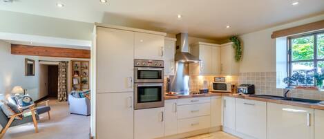 Oven, dishwasher, high chair, cookware/dishes/utensils