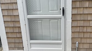 A white door with a sign that reads "Beach Rules" and the words "RELAX UNWIND ENJOY" below it. - 103 North Shore Blvd Unit 1 (Sandwich)