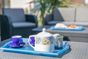 A table set with a teapot, cup, and sugar bowl on a blue tray. - 2 Bed in St. Merryn (oc-l29063) (Treyarnon Bay)