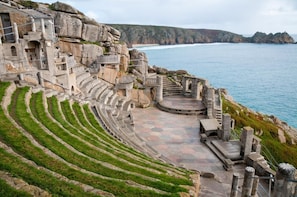 A stone amphitheater with tiered seating and a stage, overlooking a coastal area. - 2 Bed in St. Ives (oc-s28155) (St Ives)