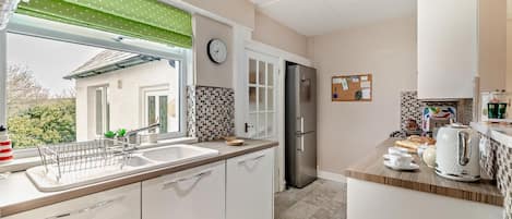 Oven, dishwasher, high chair, cookware/dishes/utensils