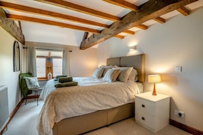A bedroom with a bed, bedside table, lamp, and a chair. - 4 Bed in Heywood (oc-t29040) (Westbury)
