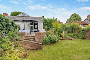 A house with a patio, a brick staircase, and a garden with various plants. - 2 Bed in Chilham (oc-b29276) (Chilham)