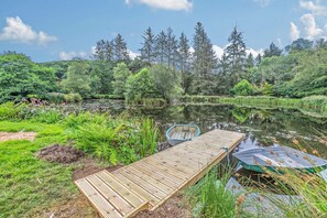 A wooden dock extending into a calm river surrounded by lush greenery and trees. - 3 Bed in Two Waters Foot (oc-l29857) (Broadoak)