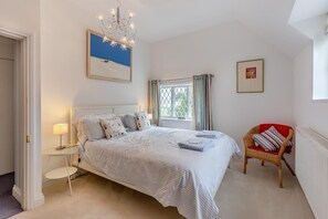 A bedroom with a bed, bedside table, lamp, window, chair, and artwork. - 2 Bed in Woofferton (oc-b29941) (Woofferton)