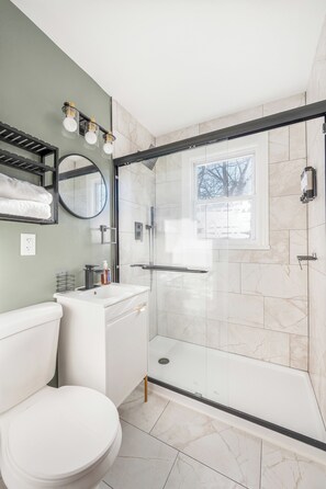 Shower, hair dryer, towels, soap