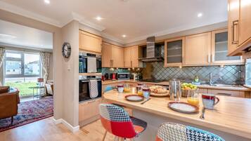 Oven, dishwasher, high chair, cookware/dishes/utensils