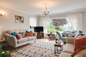 A living room with two sofas, a television, a coffee table, and a patterned rug. - 3 Bed in Hamsterley (oc-h30129) (Hamsterley)