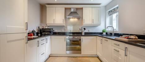 Oven, dishwasher, highchair, cookware/dishes/utensils