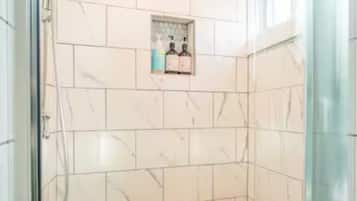Shower, towels, soap, toilet paper