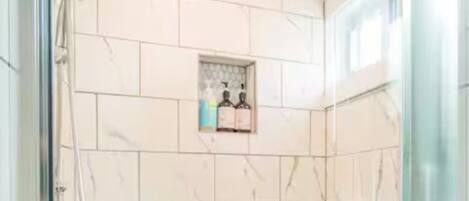 Shower, towels, soap, toilet paper