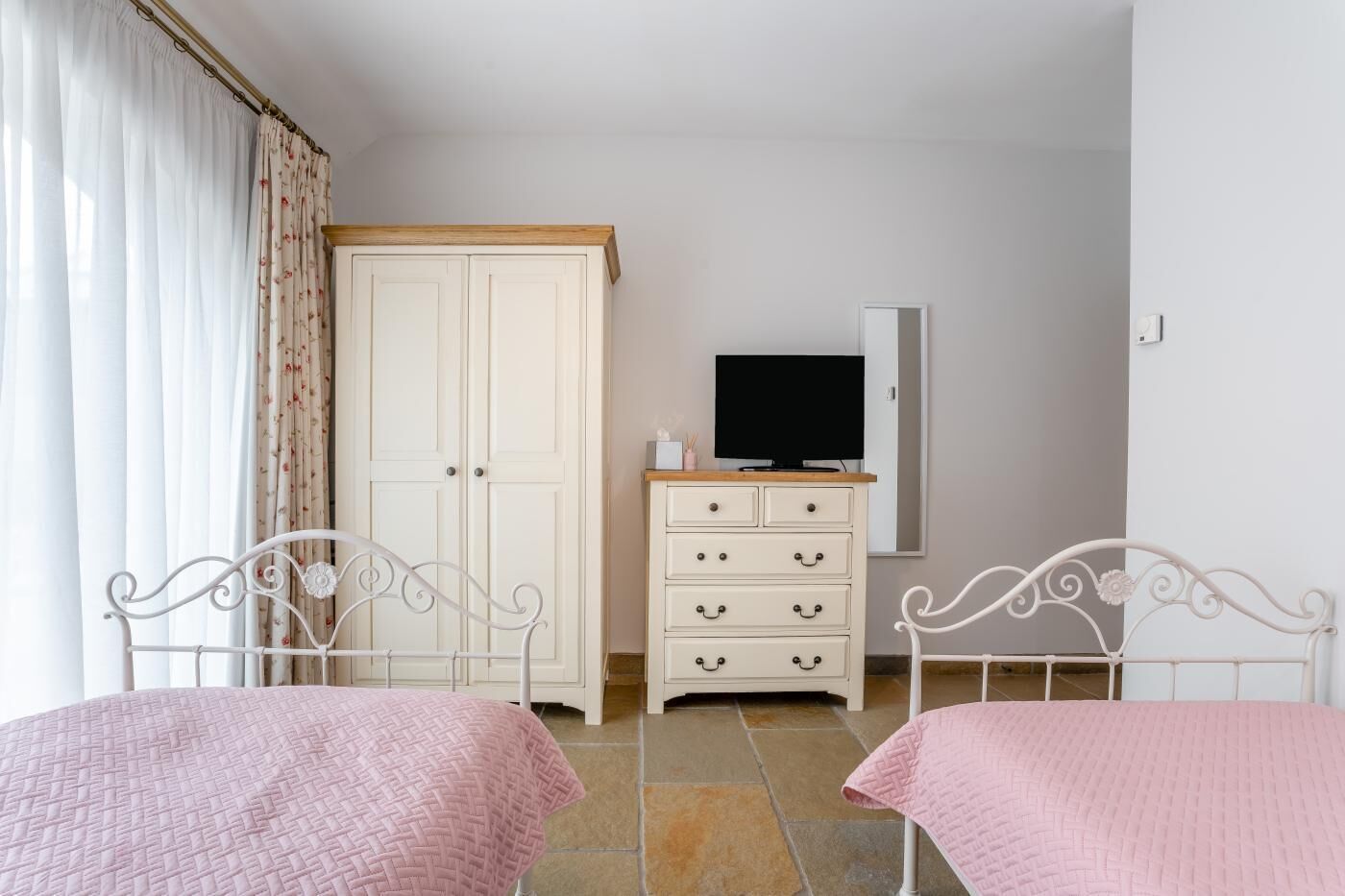 Iron/ironing board, travel crib, free WiFi, bed sheets