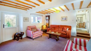 A cozy living room with striped furniture, a wooden ceiling, and a view of the outside. - 4 Bed in Mallerstang (oc-s22487) (Mallerstang)