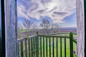 A wooden fence with a view of a grassy field and trees. - 1 Bed in Methven (oc-v30533) (Methven)