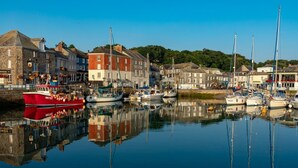 A harbor with boats docked, stone buildings, and a clear sky. - 3 Bed in Winnards Perch (oc-m30557) (Winnard's Perch)
