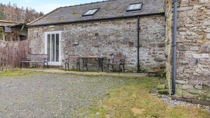 A stone building with a gravel driveway and a wooden fence. - 2 Bed in Eggleston (oc-s30453) (Middleton-in-Teesdale)