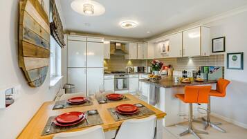 Oven, dishwasher, high chair, cookware/dishes/utensils