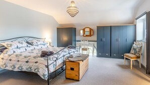 A bedroom with a bed, a wooden chest, a desk, and a wardrobe. - 3 Bed in Crowle (oc-s30617) (Crowle)