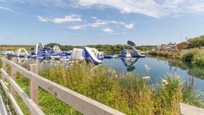A water park with inflatable slides and play structures. - 6 Bed in Winnards Perch (oc-c30624) (Winnard's Perch)