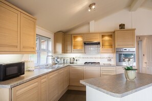 Microwave, oven, high chair, cookware/dishes/utensils