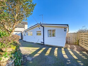 A small, single-story house with a sloped roof, a chimney, and a small window. - 2 Bed in Mawgan (oc-c30671) (Mawgan)