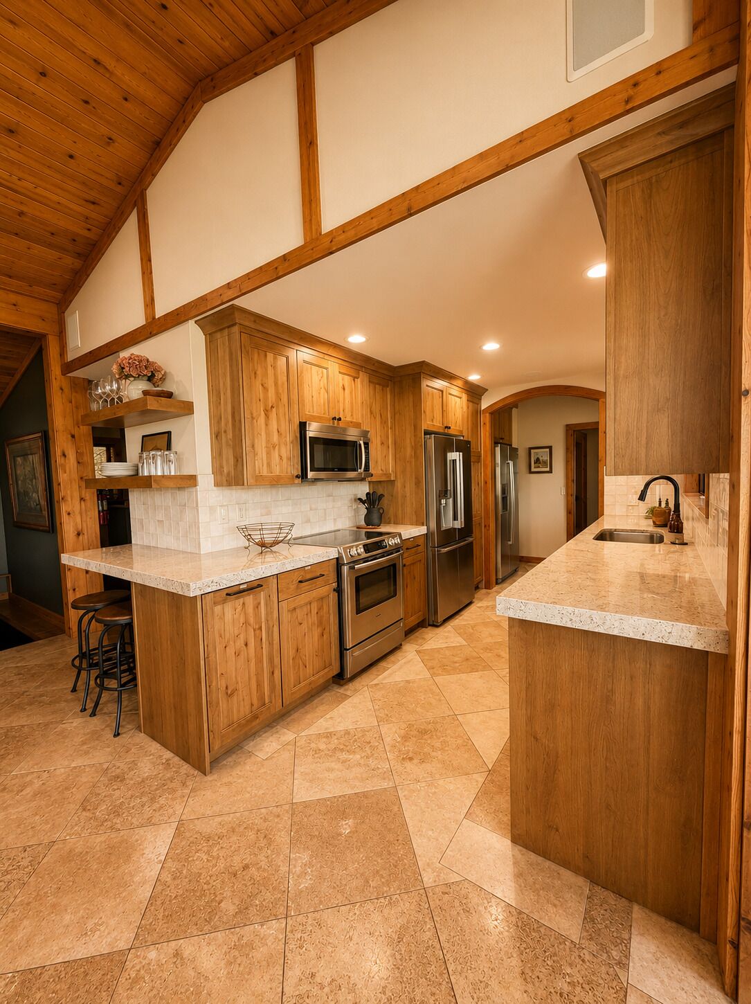 A kitchen with wooden cabinets, stainless steel appliances, a marble countertop, and a tiled floor.