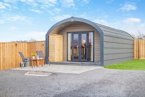 A single-story building with a curved roof and a large glass door entrance. - 1 Bed in East Cowton (oc-w30480) (East Cowton)