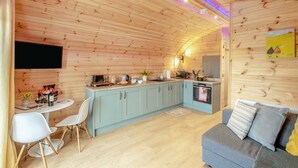 A cozy cabin interior with a dining area, kitchen, and seating space. - 1 Bed in East Cowton (oc-w30480) (East Cowton)