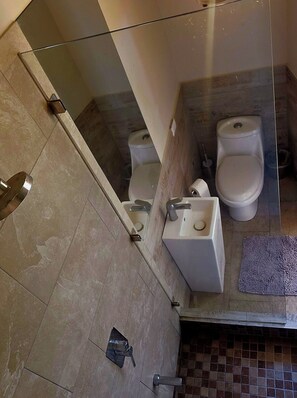 A bathroom with two toilets, a sink, and a glass shower enclosure. - A Slice of Paradise.
Superb private luxury tent with stunning ocean view (Ocotal beach)