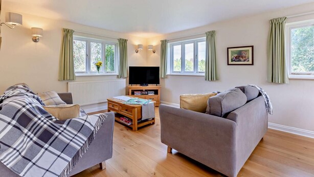 A cozy living room with two sofas, a coffee table, and a TV. - 2 Bed in Hanley William (oc-d30115) (Hanley William)