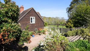 A wooden house with a sloped roof and a small window. - 2 Bed in Hanley William (oc-d30115) (Hanley William)